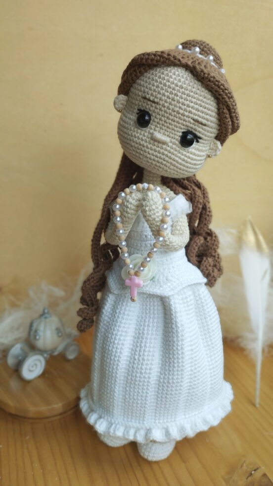 Handmade crochet amigurumi doll with detailed clothing