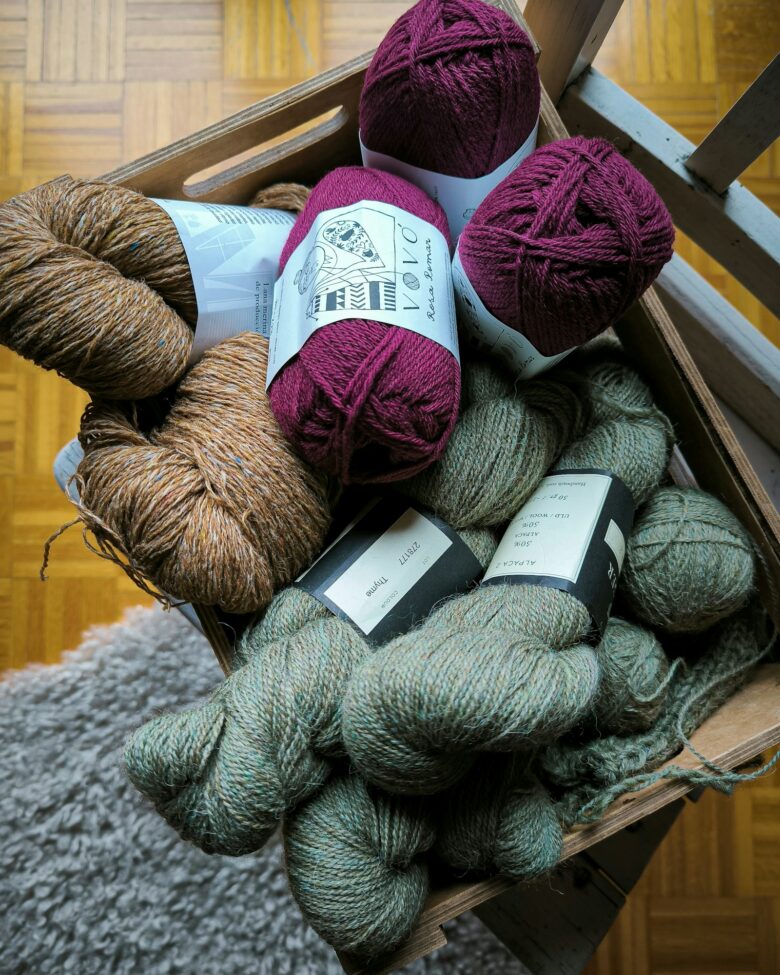 A curated selection of soft medium-weight yarn for a granny-square blanket
