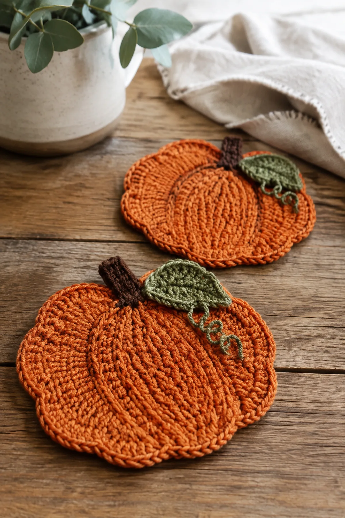 Finished crochet pumpkin mini trivets displayed with a clean handmade finish