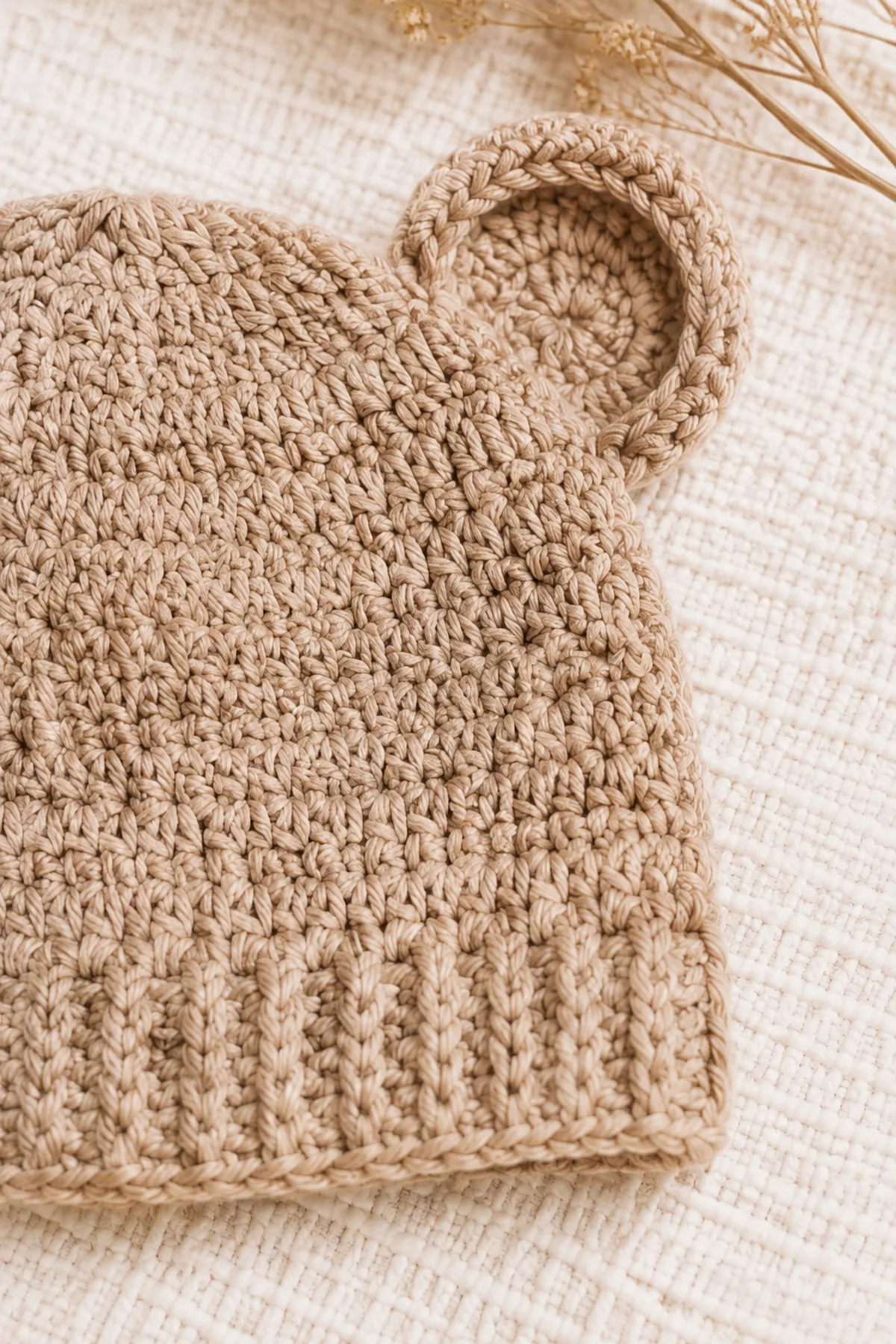 Close-up of the stitch texture and finishing details on easy crochet bear ear baby hat